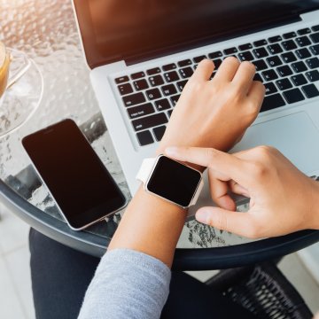 checking smartwatch smartphone laptop apple watch